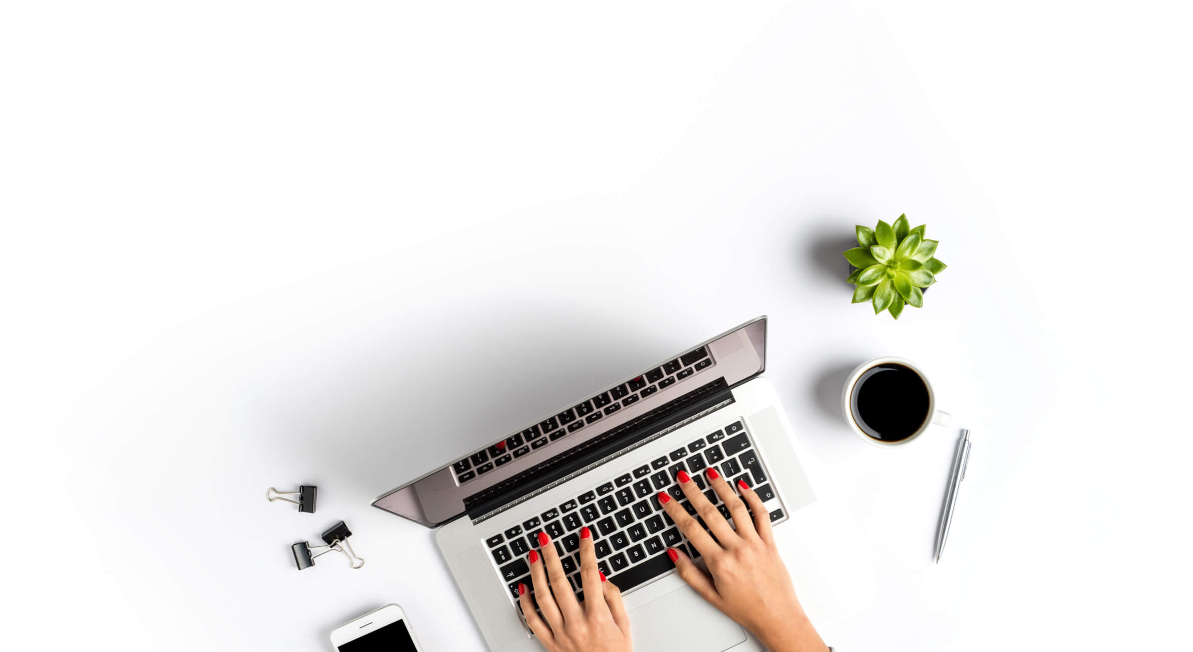 Close up of woman's hands using a laptop