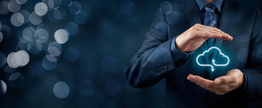 Businessman's hands cupping a cloud icon