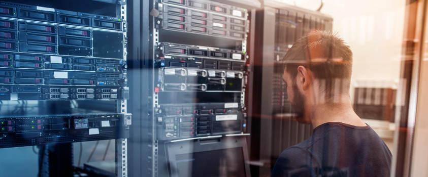 Technician working in a data networking center